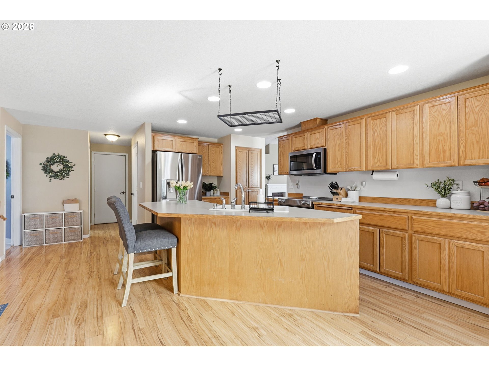 227 West 14th Street Lafayette, OR 97127 - Photo 17 of 36 a kitchen with stainless steel appliances granite countertop a sink a stove a dining table and chairs