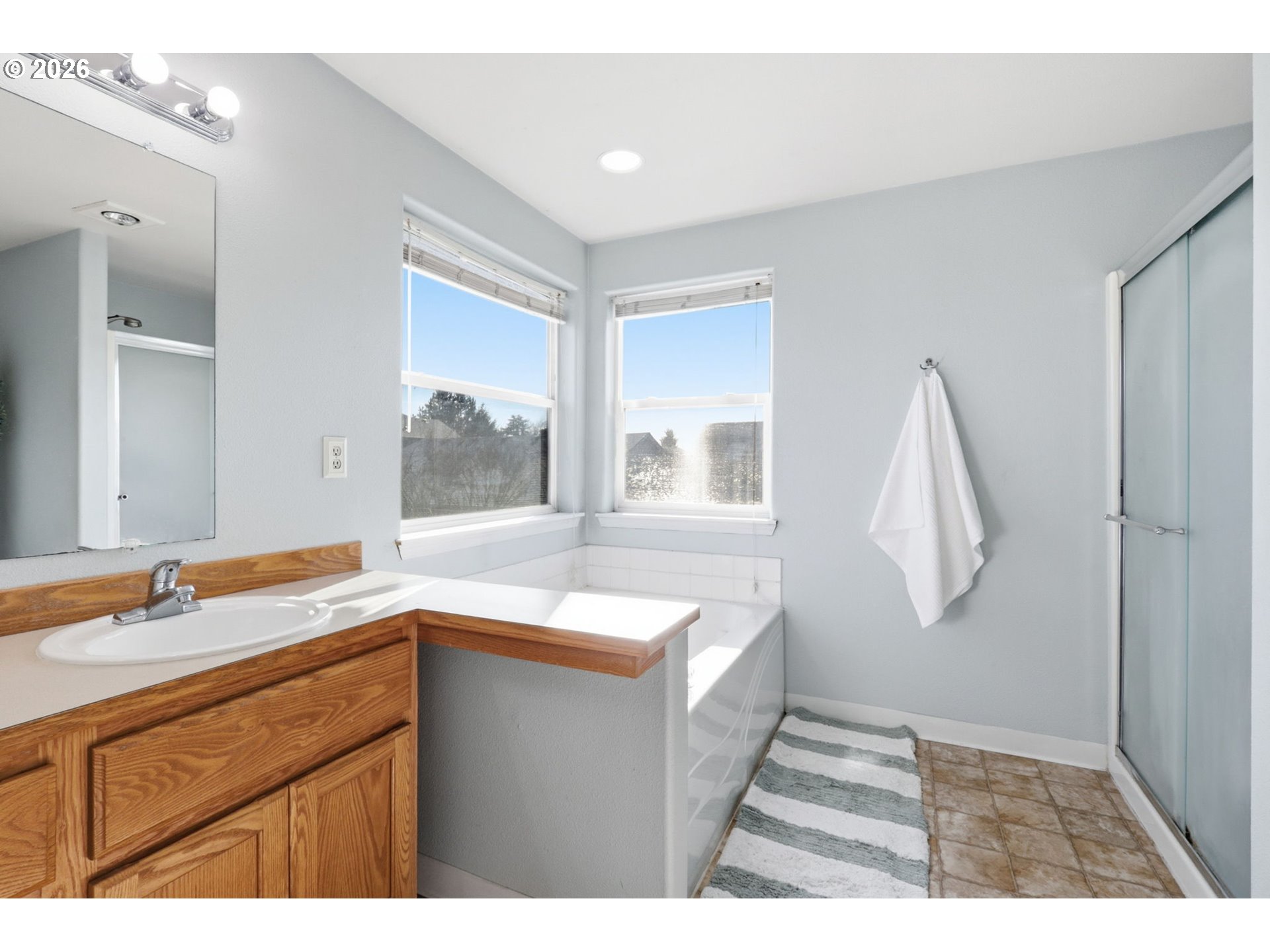 227 West 14th Street Lafayette, OR 97127 - Photo 29 of 36 a bathroom with a sink and a mirror