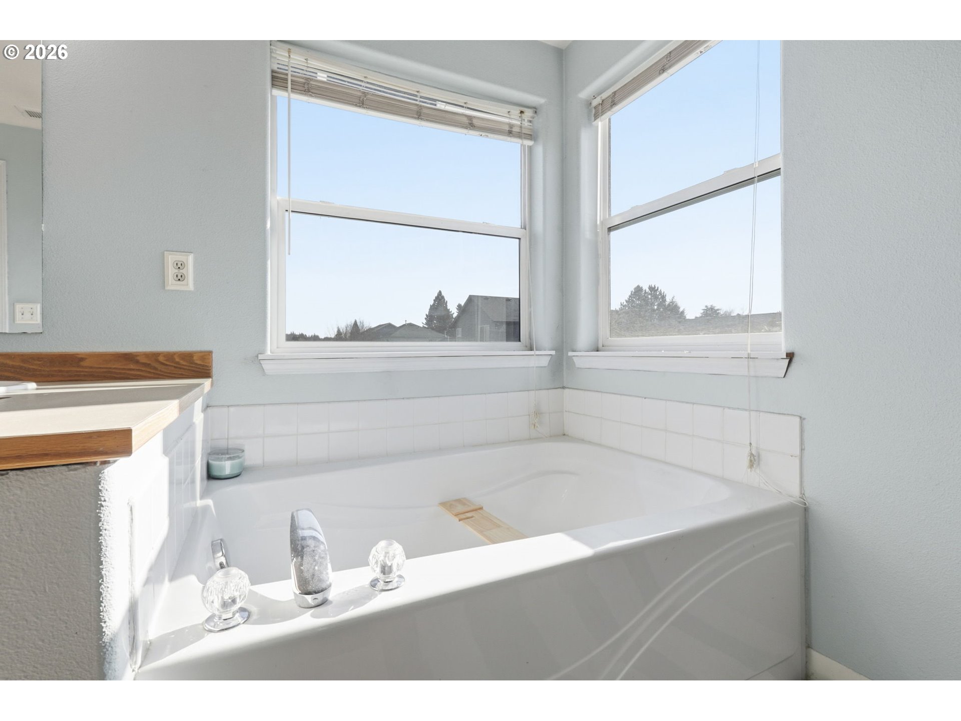 227 West 14th Street Lafayette, OR 97127 - Photo 30 of 36 a bathroom with a bathtub sink and mirror