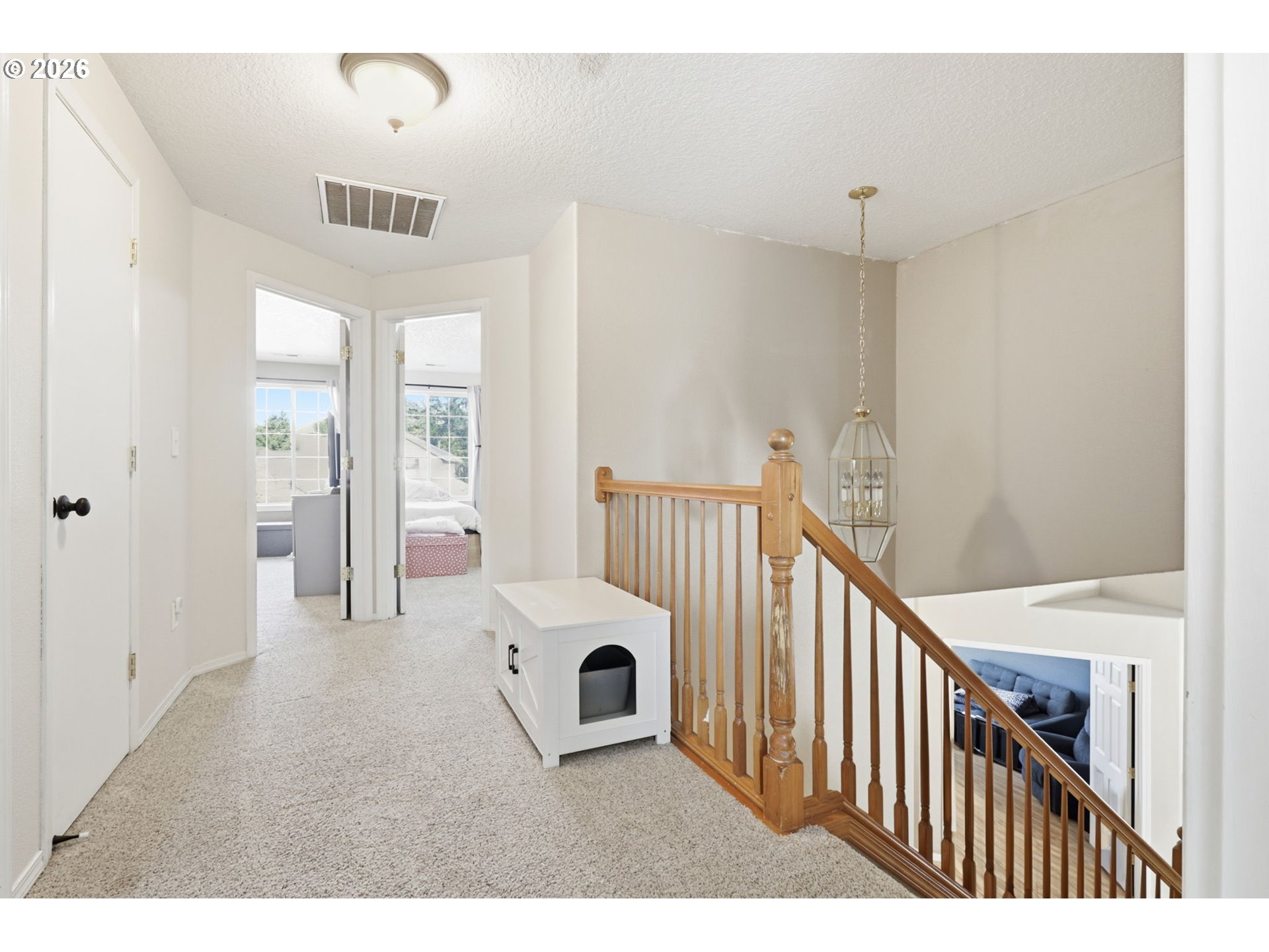 227 West 14th Street Lafayette, OR 97127 - Photo 31 of 36 a view of a hallway with a dining table & a chandelier