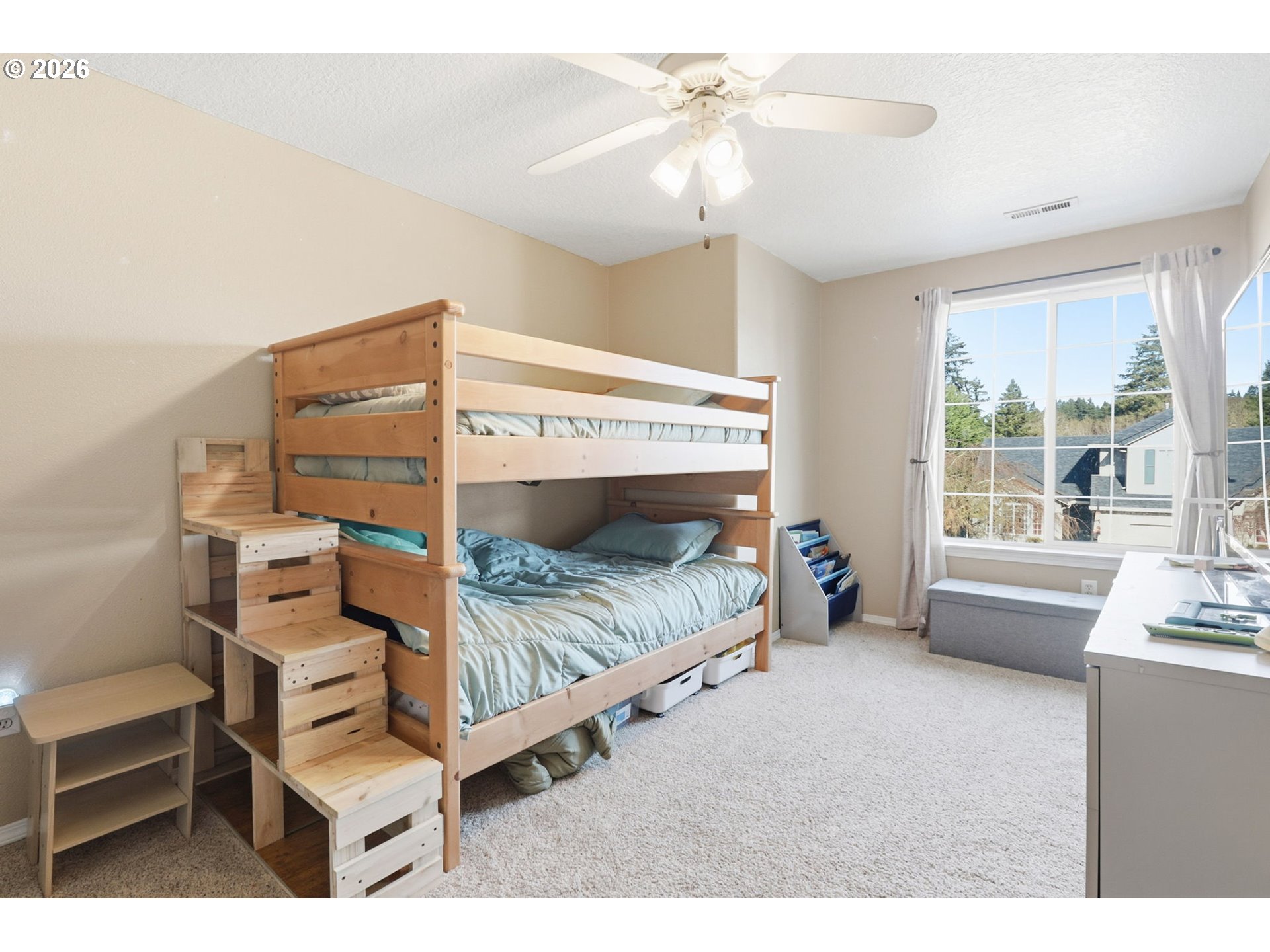 227 West 14th Street Lafayette, OR 97127 - Photo 33 of 36 a bedroom with a bed a chandelier and a window
