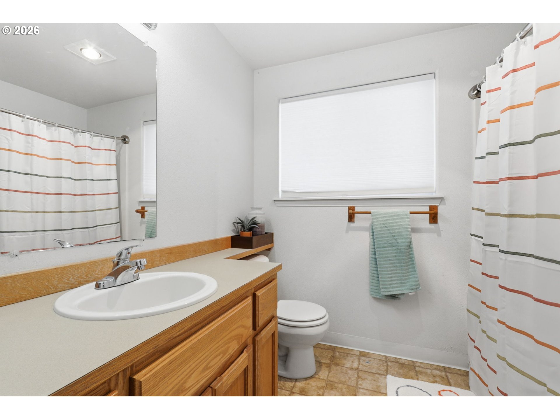 227 West 14th Street Lafayette, OR 97127 - Photo 34 of 36 a bathroom with a sink toilet and mirror