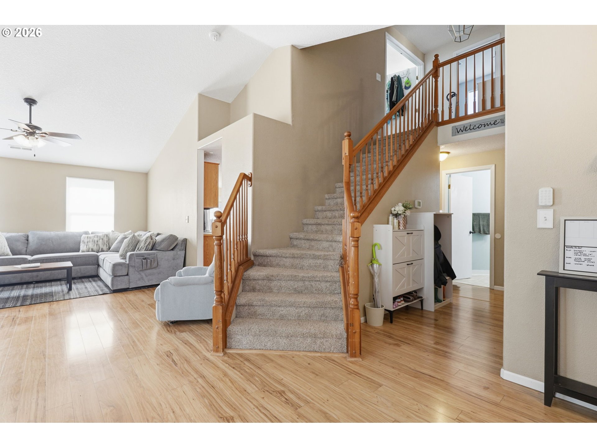 227 West 14th Street Lafayette, OR 97127 - Photo 8 of 36 a living room with couches and stairs with wooden floor