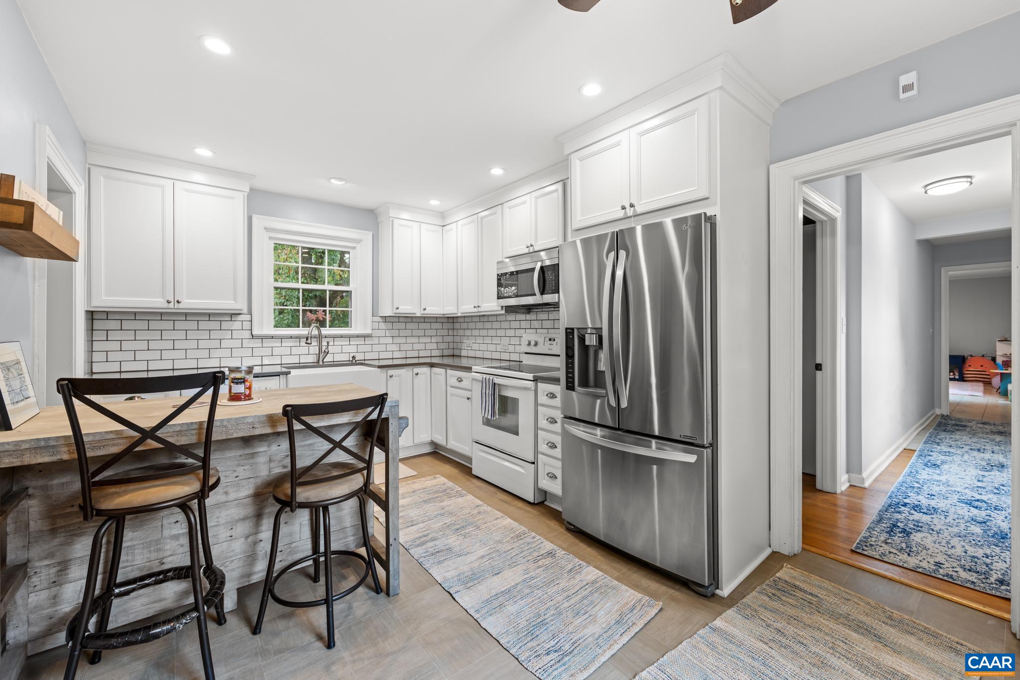 3304 Keswick Road Keswick, VA 22947 - Photo 12 of 38 a kitchen with stainless steel appliances granite countertop a refrigerator and a stove top oven