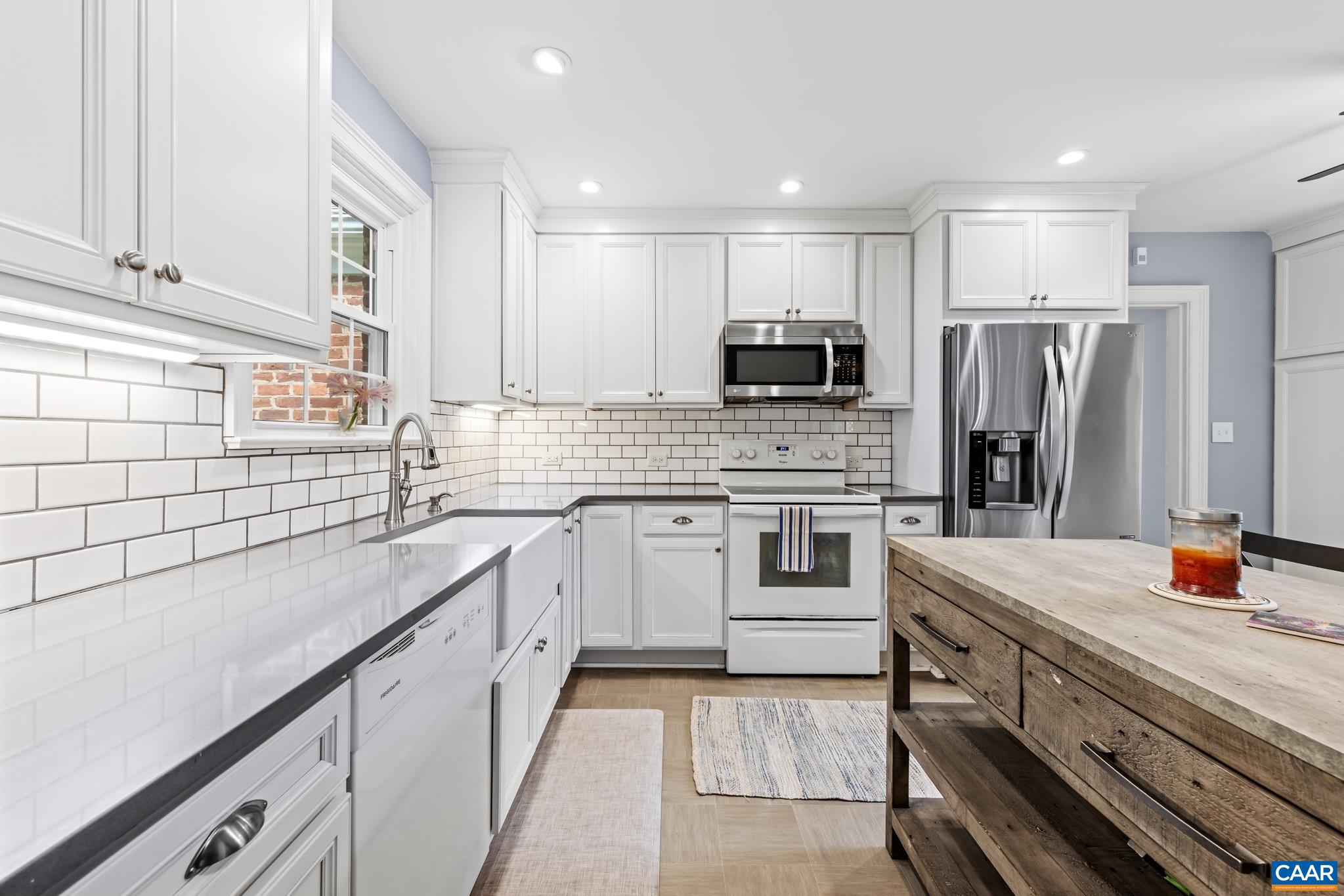 3304 Keswick Road Keswick, VA 22947 - Photo 14 of 38 a kitchen with stainless steel appliances a stove sink and microwave