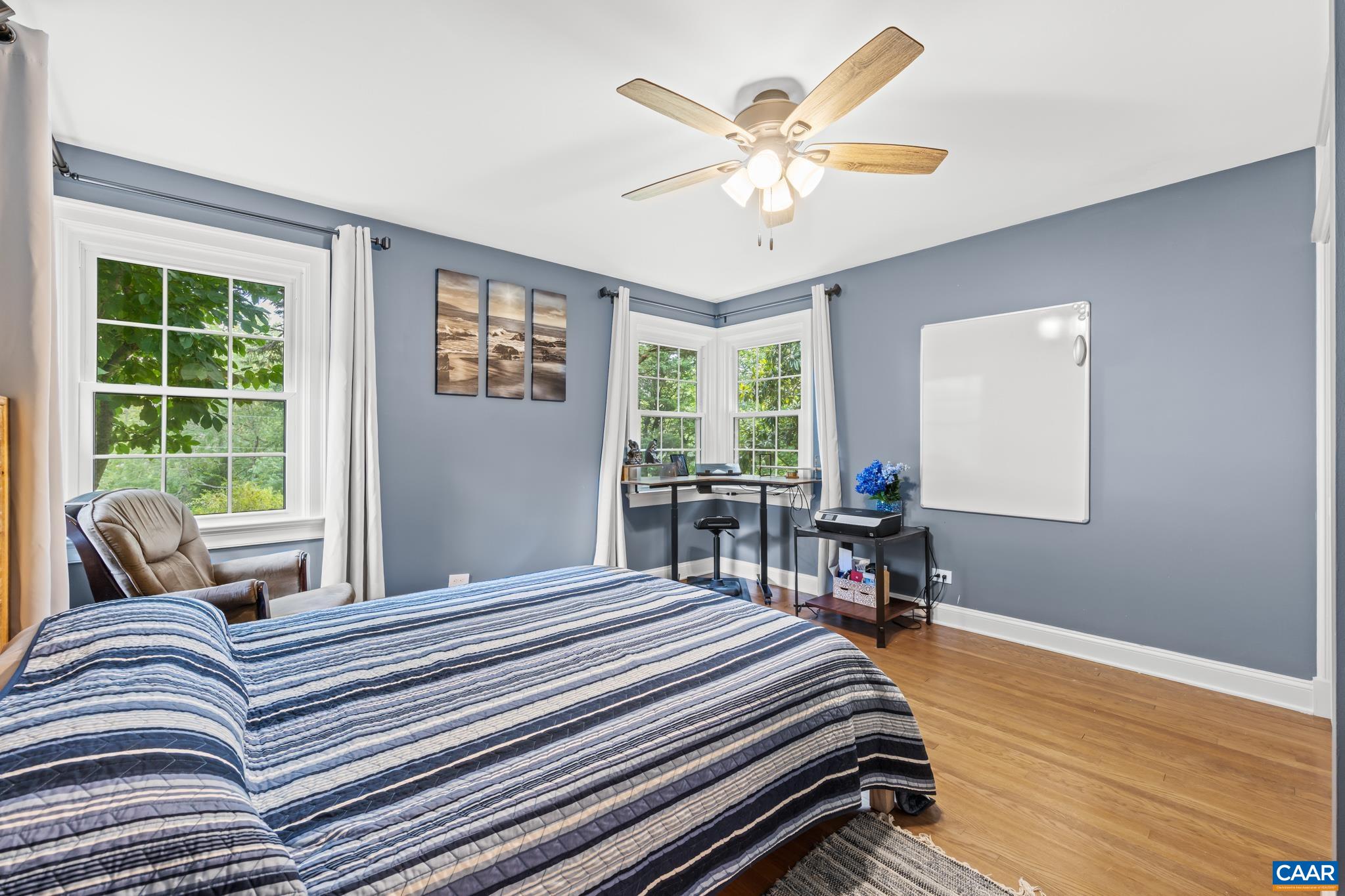 3304 Keswick Road Keswick, VA 22947 - Photo 20 of 38 a bedroom with a bed and a large window with chair