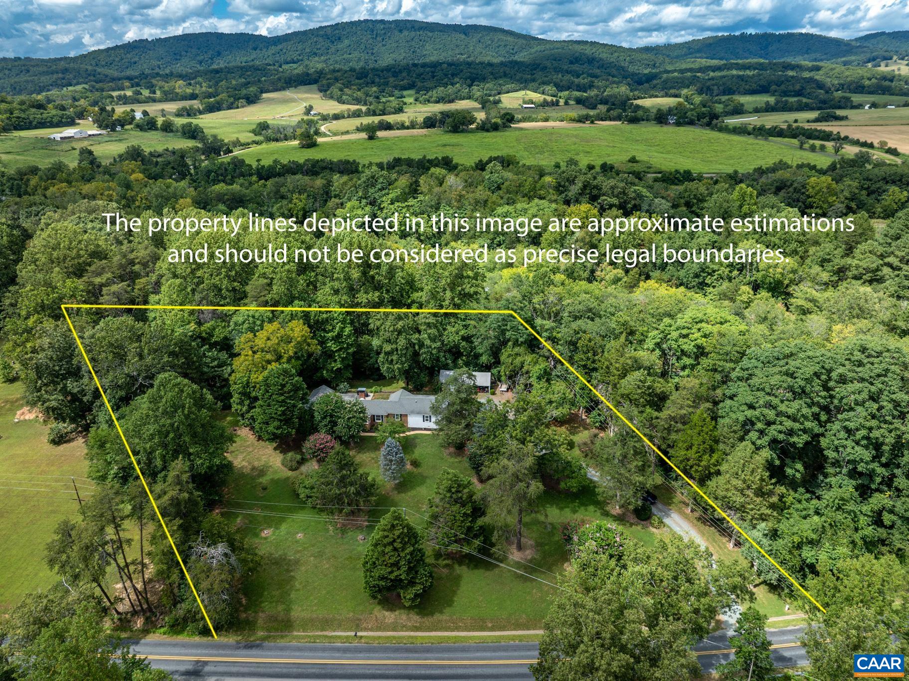 3304 Keswick Road Keswick, VA 22947 - Photo 2 of 38 a view of a lush green forest with lots of trees