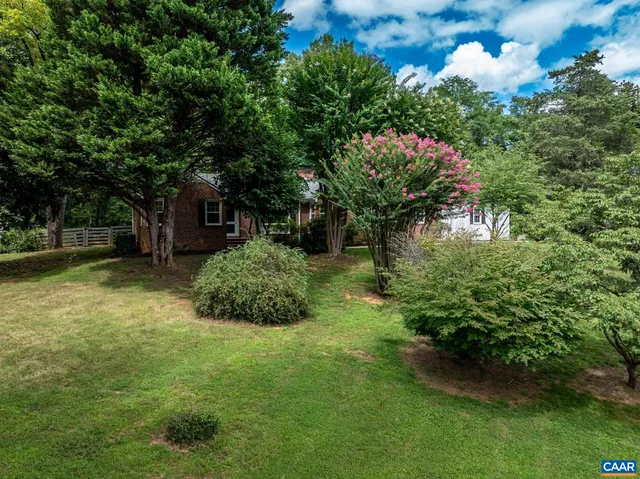 a backyard of a house with lots of green space