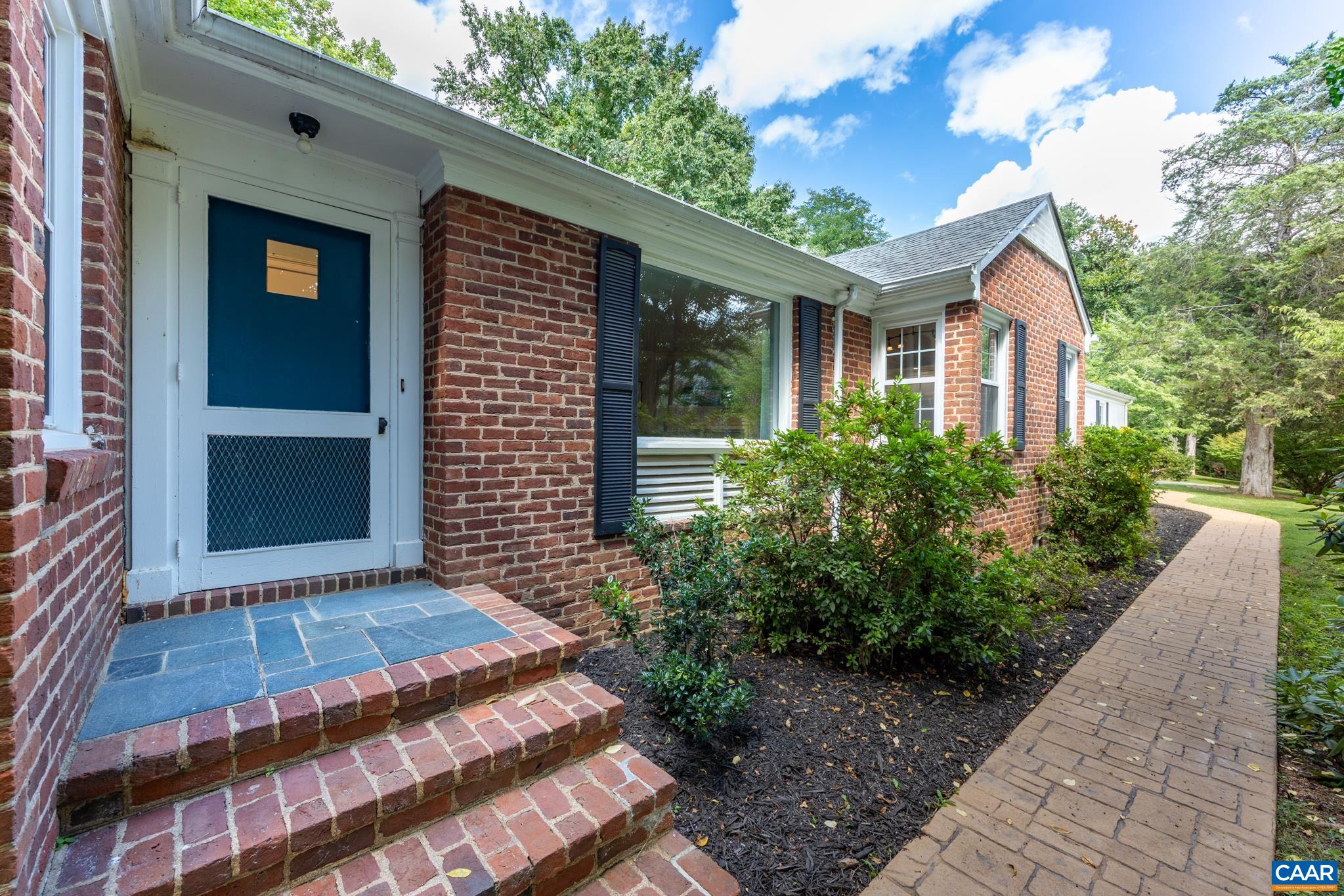 3304 Keswick Road Keswick, VA 22947 - Photo 5 of 38 a front view of a house with a garden