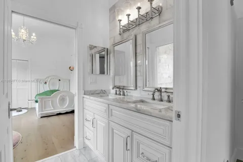 a bathroom with a sink double vanity and a mirror