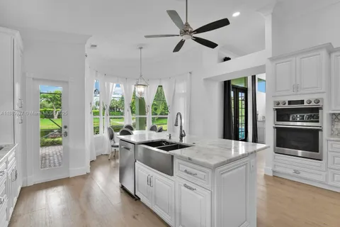 a kitchen that has a stove and a sink