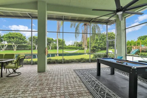 a view of a swimming pool with a patio