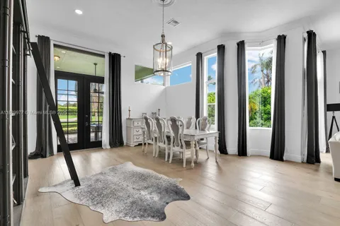 a view of a dining room with furniture window and outside view
