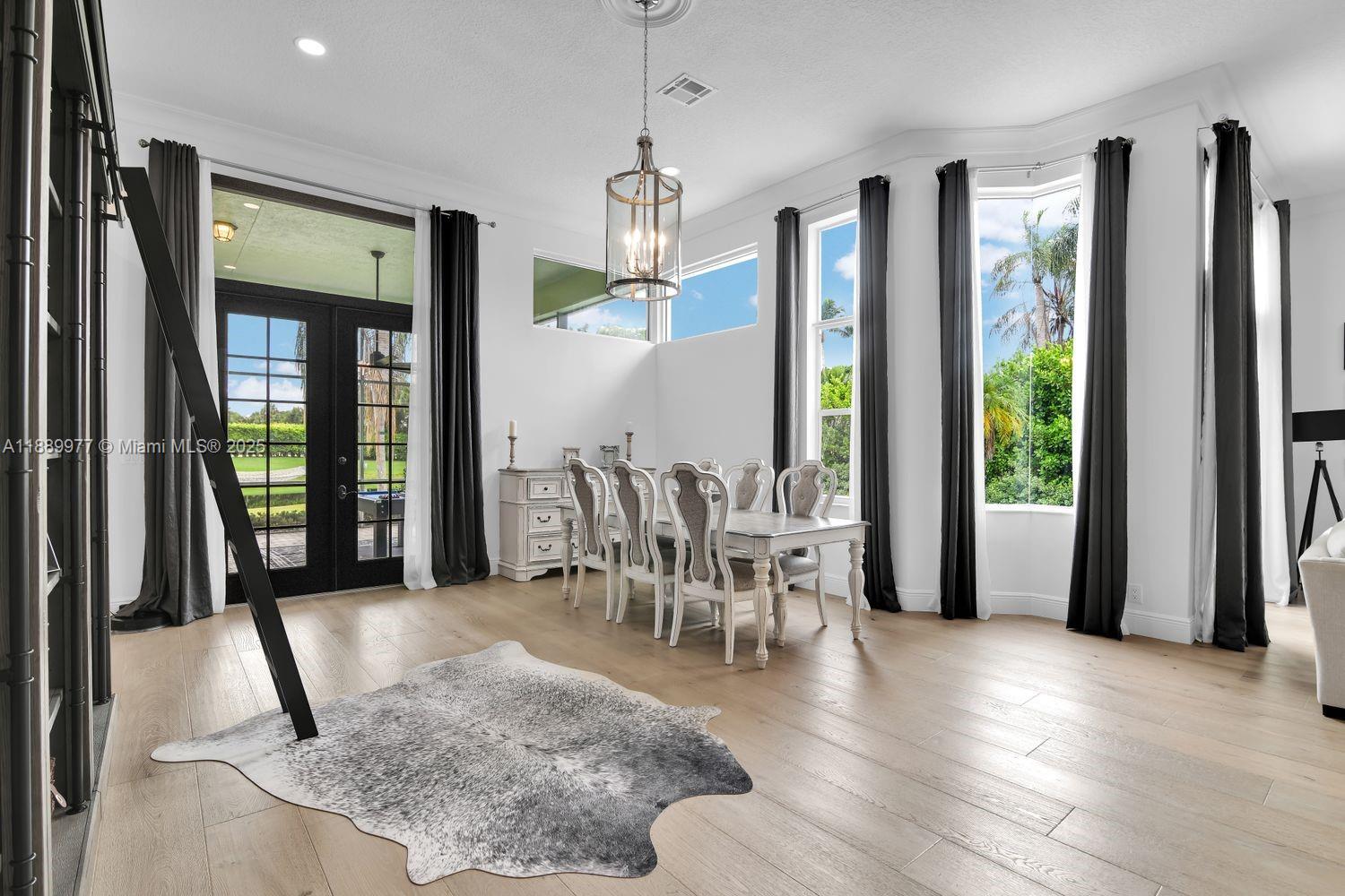 6622 Newport Lake Circle Boca Raton, FL 33496 - Photo 4 of 30 a view of a dining room with furniture window and outside view