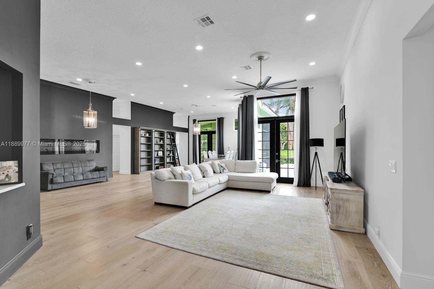 6622 Newport Lake Circle Boca Raton, FL 33496 - Photo 5 of 30 a living room with furniture window and a flat screen tv