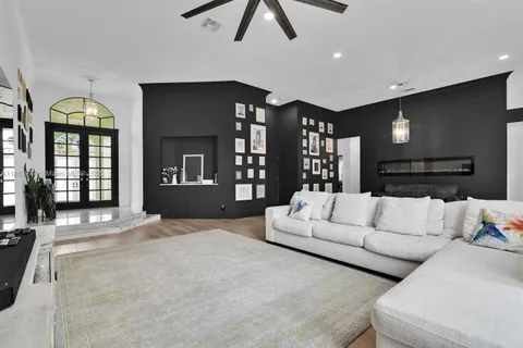 a living room with furniture and a large window