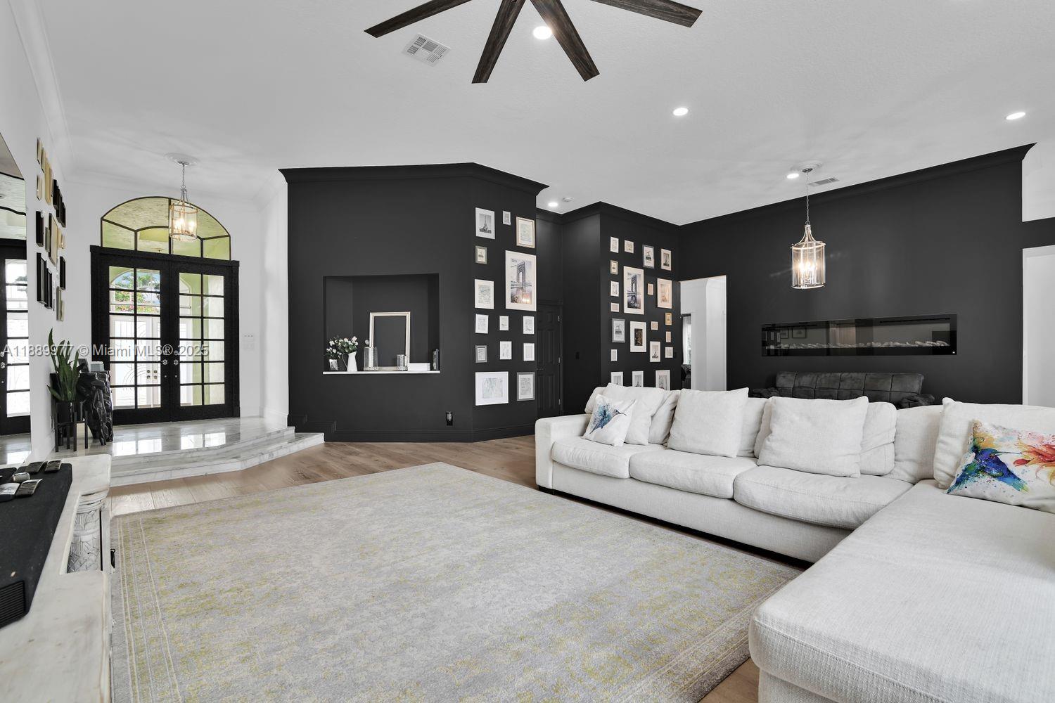 6622 Newport Lake Circle Boca Raton, FL 33496 - Photo 6 of 30 a living room with furniture and a large window