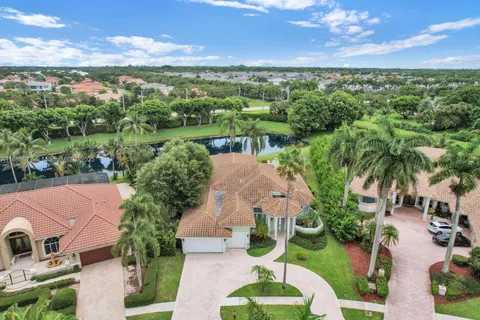 an aerial view of multiple house with a yard