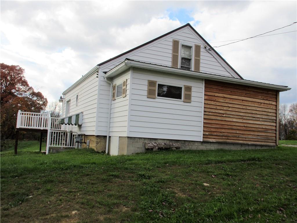 993 Bartley Road Parker, PA 16049 - Photo 1 of 25 a front view of a house with a yard