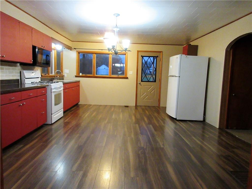 993 Bartley Road Parker, PA 16049 - Photo 5 of 25 a view of a kitchen with wooden floor and electronic appliances