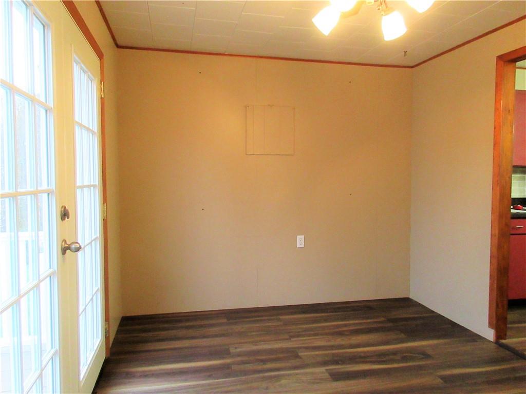 993 Bartley Road Parker, PA 16049 - Photo 8 of 25 a view of an empty room with wooden floor and a window