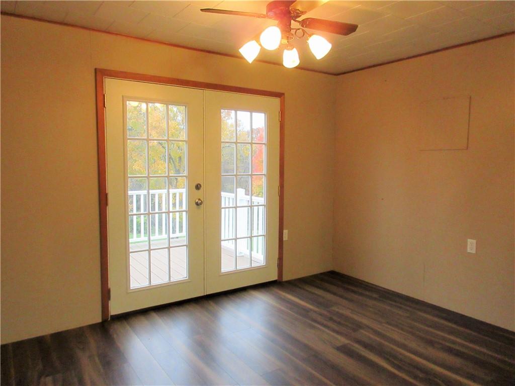 993 Bartley Road Parker, PA 16049 - Photo 9 of 25 a view of an empty room with wooden floor and a window