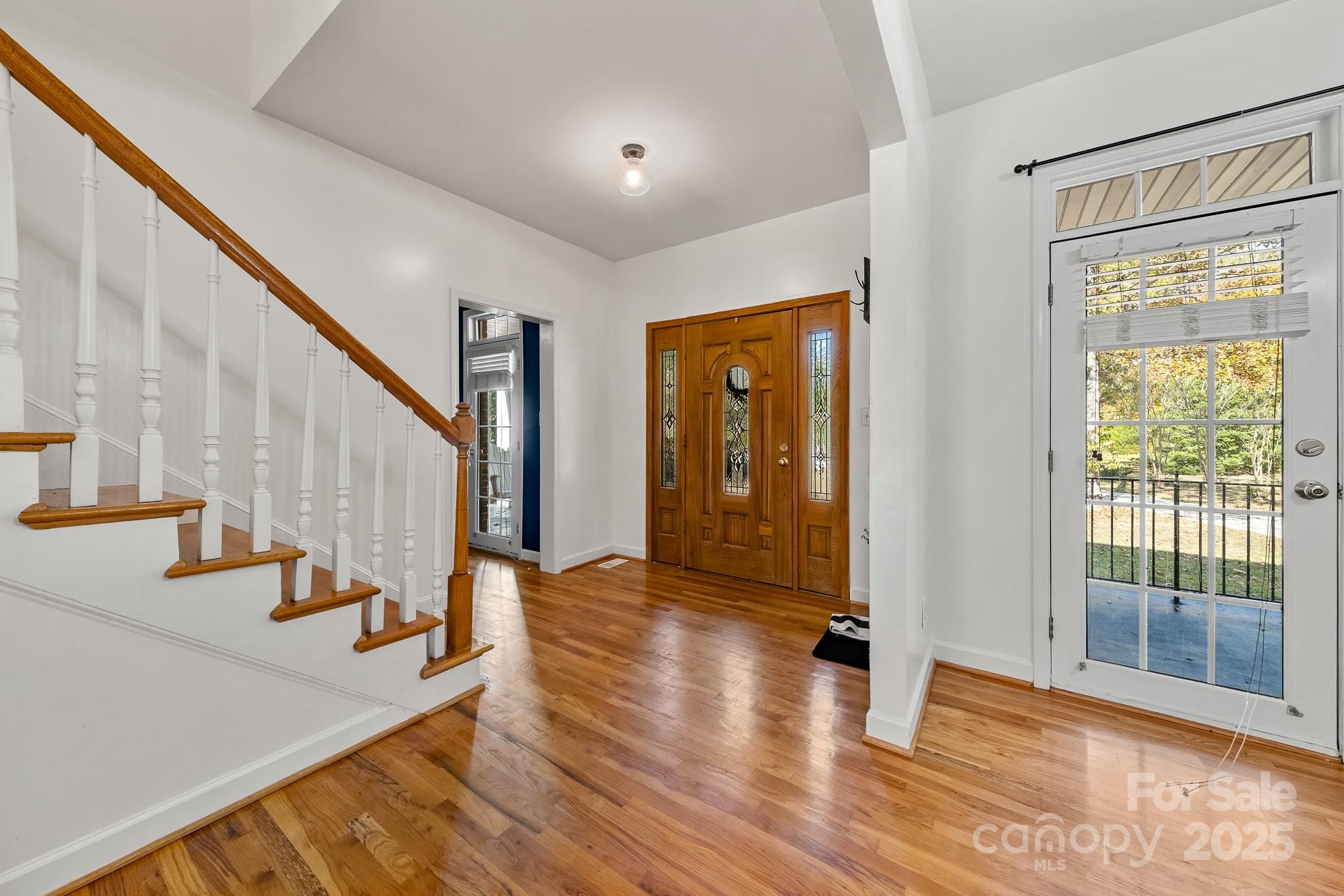 1713 Oak Park Court Iron Station, NC 28080 - Photo 11 of 39 a view of an entryway with wooden floor and door