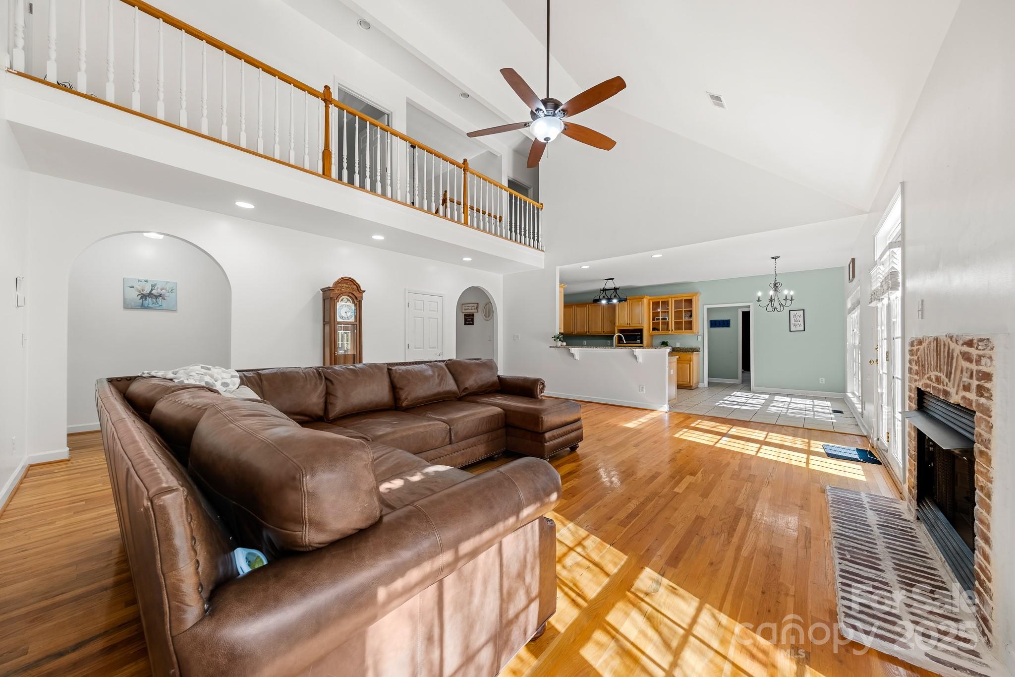 1713 Oak Park Court Iron Station, NC 28080 - Photo 14 of 39 a living room with furniture and a fireplace