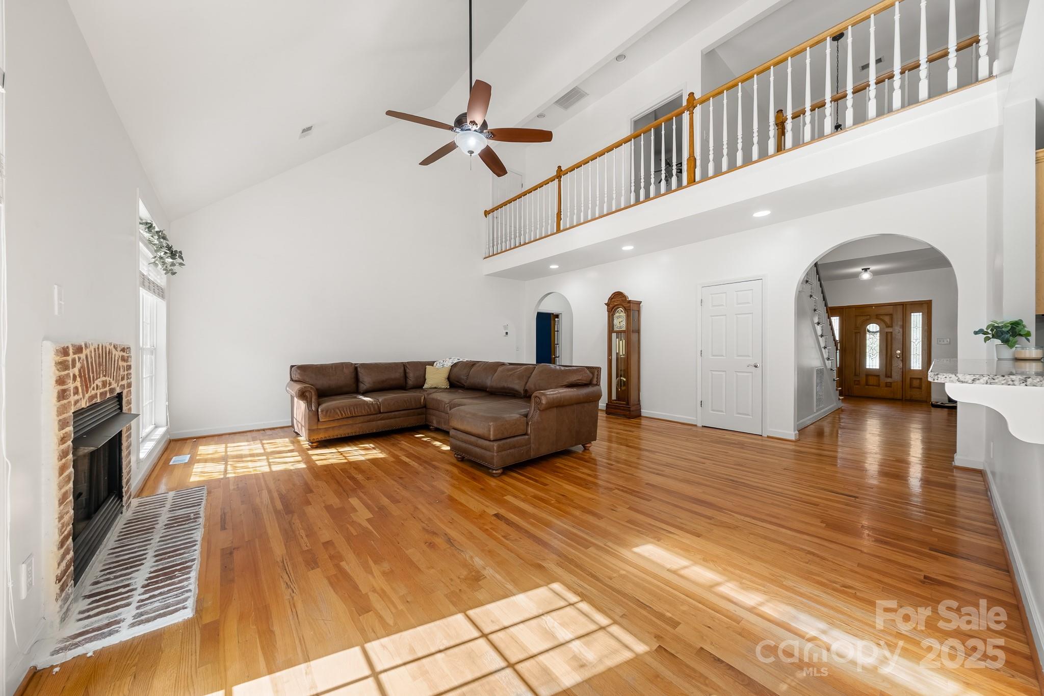 1713 Oak Park Court Iron Station, NC 28080 - Photo 16 of 39 a living room with furniture and a wooden floor
