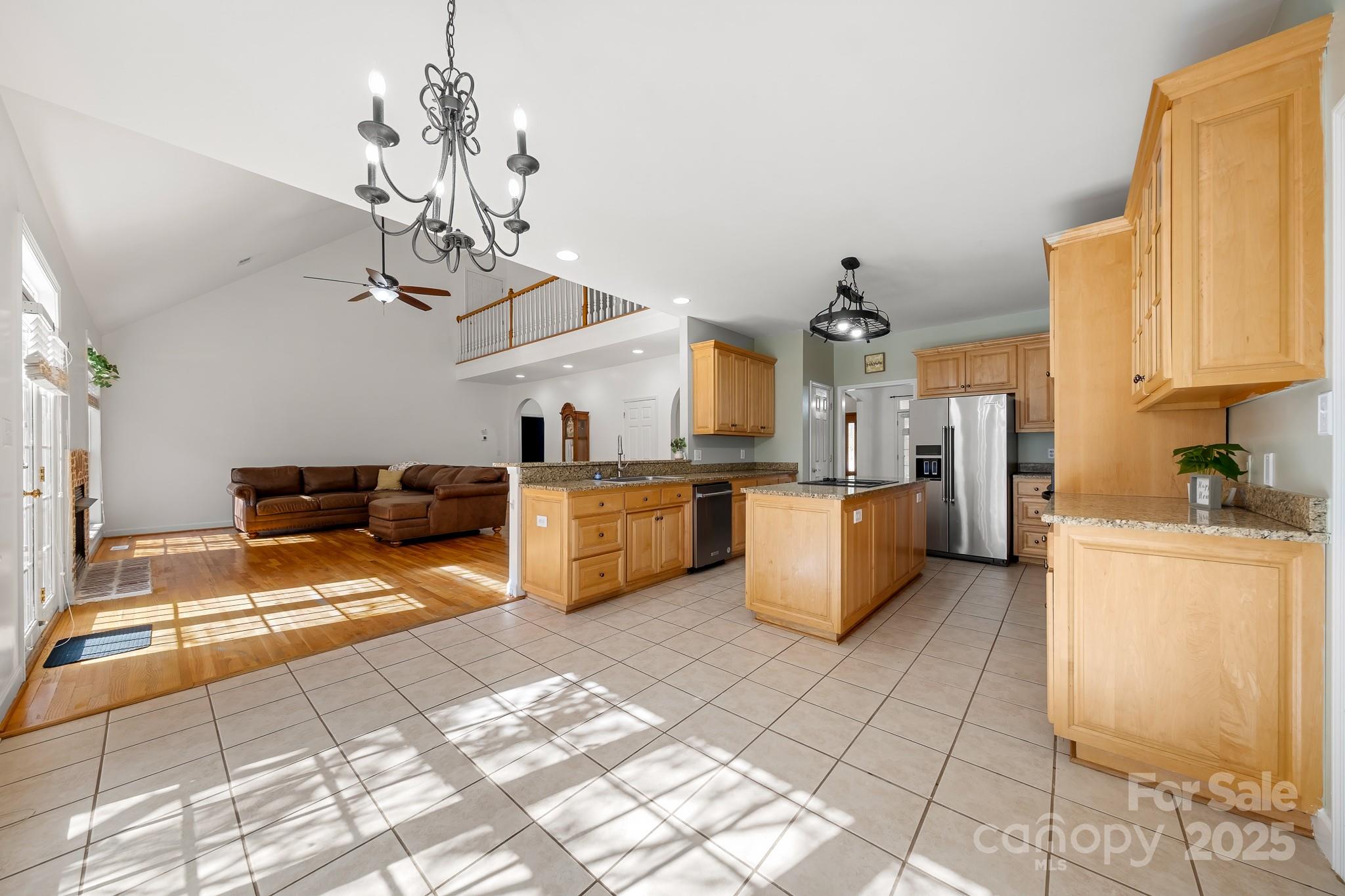 1713 Oak Park Court Iron Station, NC 28080 - Photo 17 of 39 a kitchen with stainless steel appliances granite countertop a sink dishwasher stove top oven and cabinets