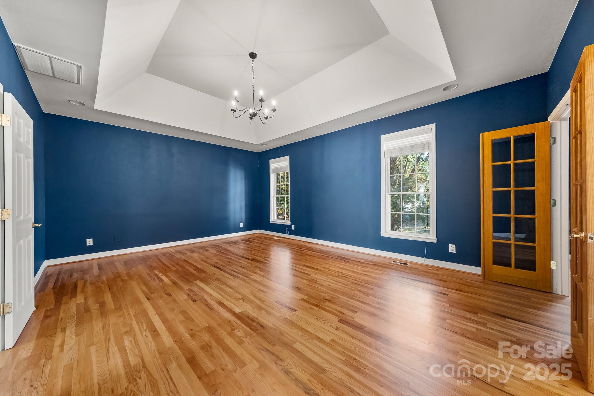 1713 Oak Park Court Iron Station, NC 28080 - Photo 22 of 39 a view of empty room with wooden floor and fan