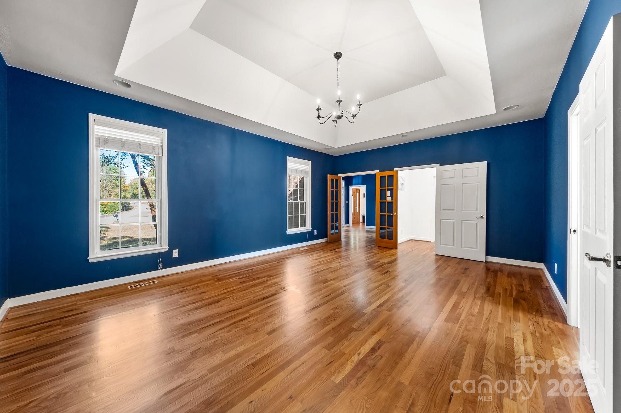 1713 Oak Park Court Iron Station, NC 28080 - Photo 23 of 39 a view of an empty room with wooden floor and a window