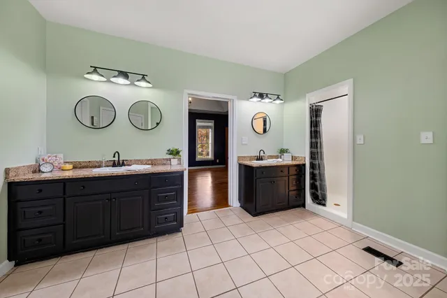 a view of a livingroom with a ceiling fan and window