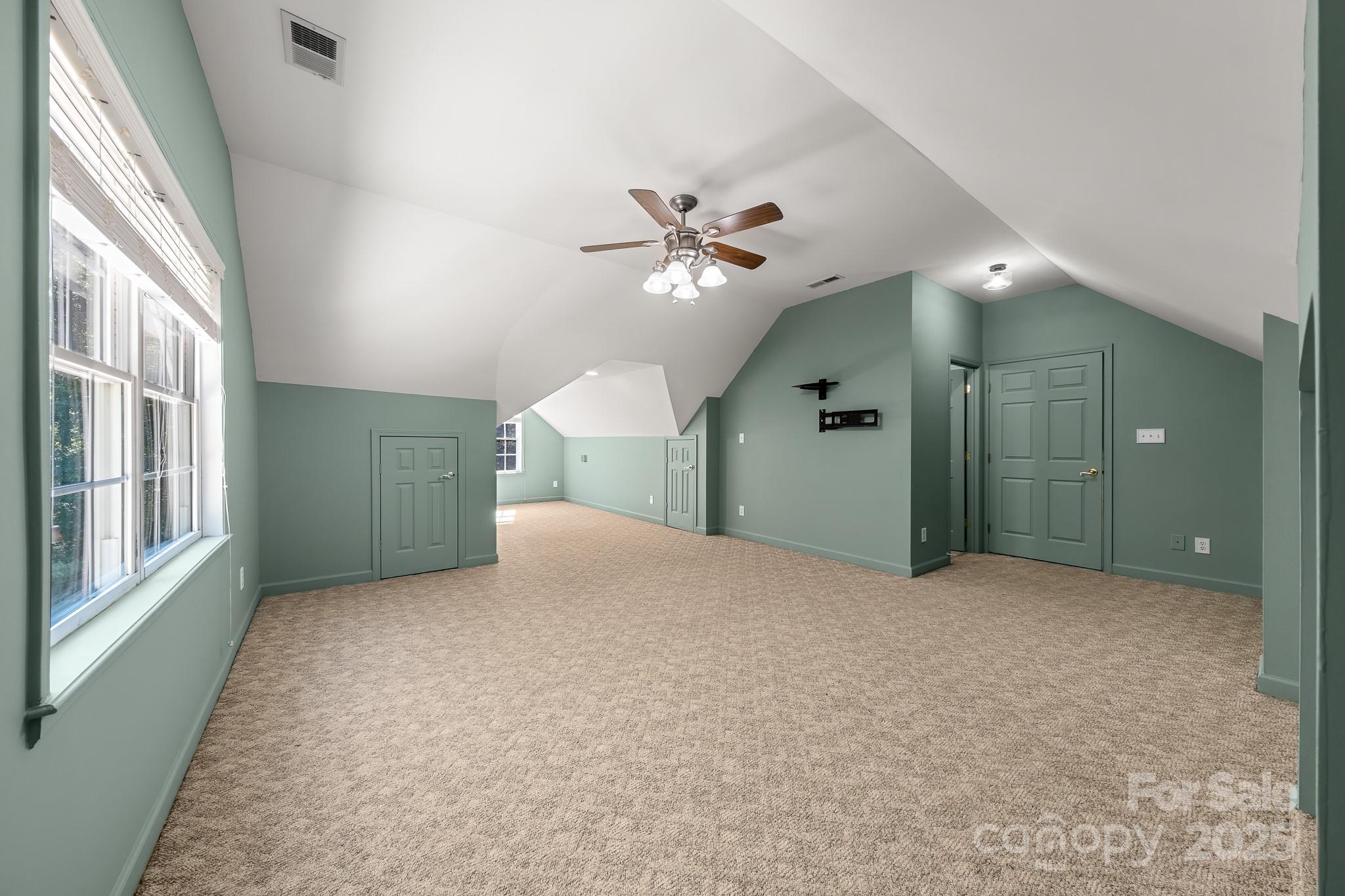1713 Oak Park Court Iron Station, NC 28080 - Photo 26 of 39 a view of a livingroom with a ceiling fan and window