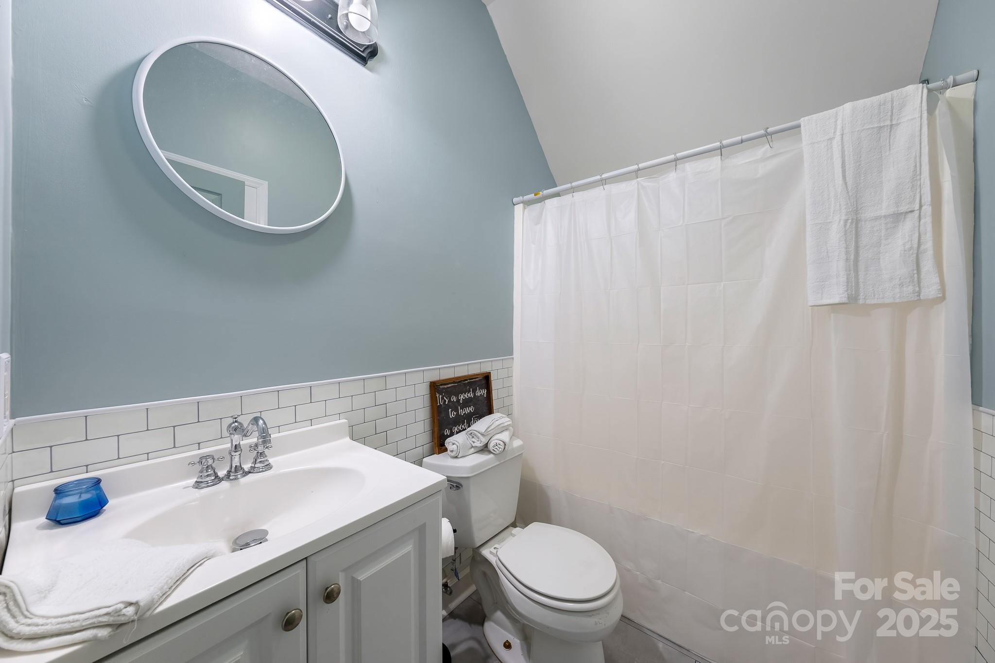 1713 Oak Park Court Iron Station, NC 28080 - Photo 29 of 39 a bathroom with a sink and a mirror