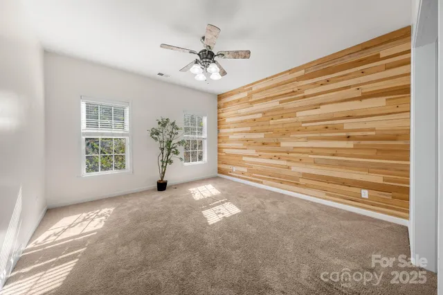 a view of an empty room with a potted plant