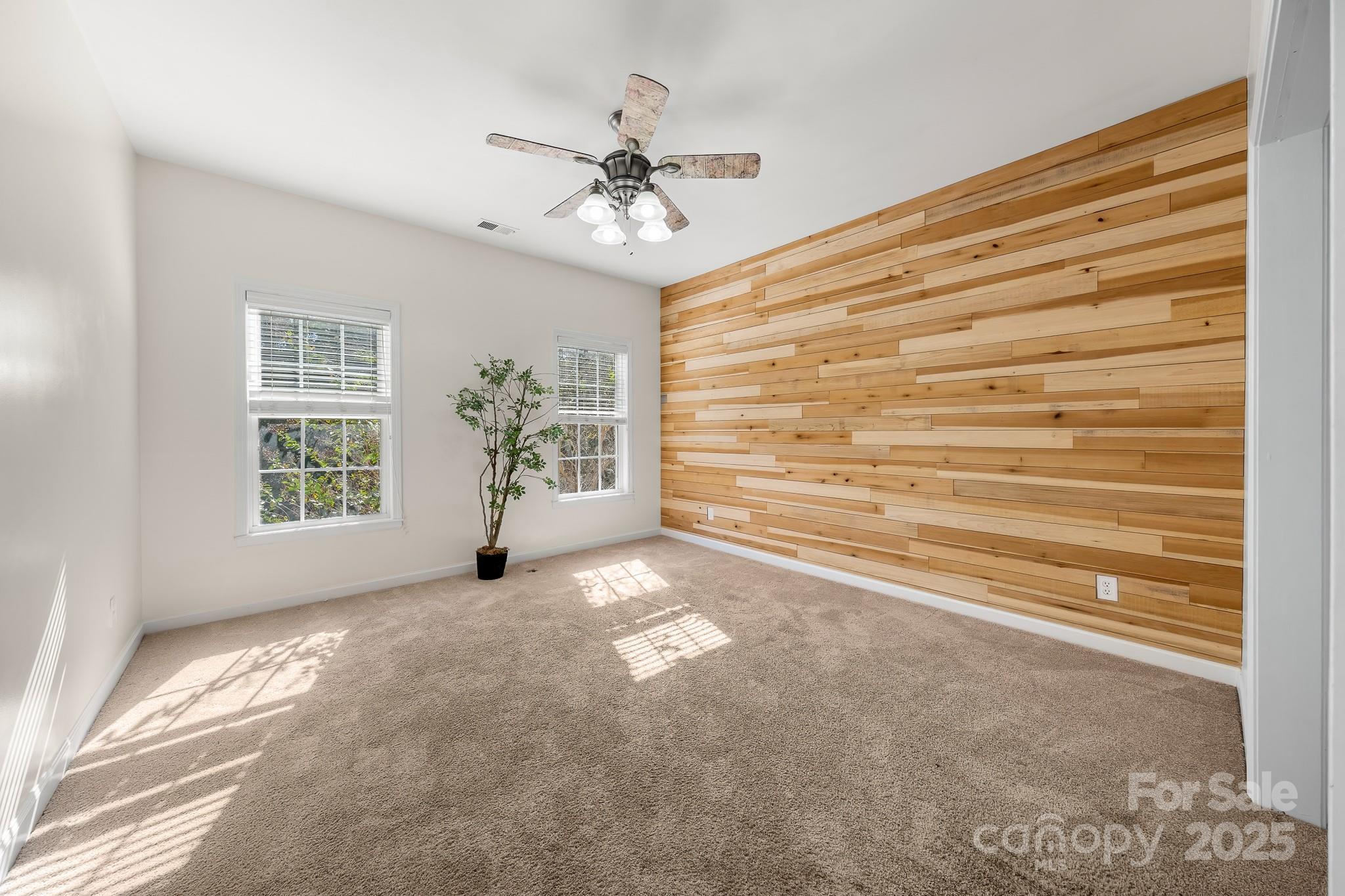 1713 Oak Park Court Iron Station, NC 28080 - Photo 30 of 39 a view of empty room with window and ceiling fan