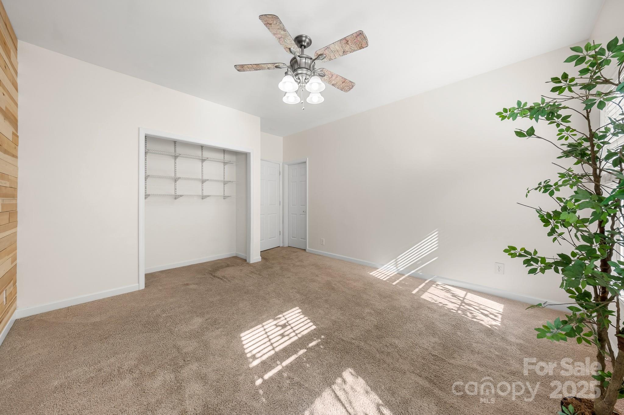 1713 Oak Park Court Iron Station, NC 28080 - Photo 31 of 39 a view of an empty room with a potted plant