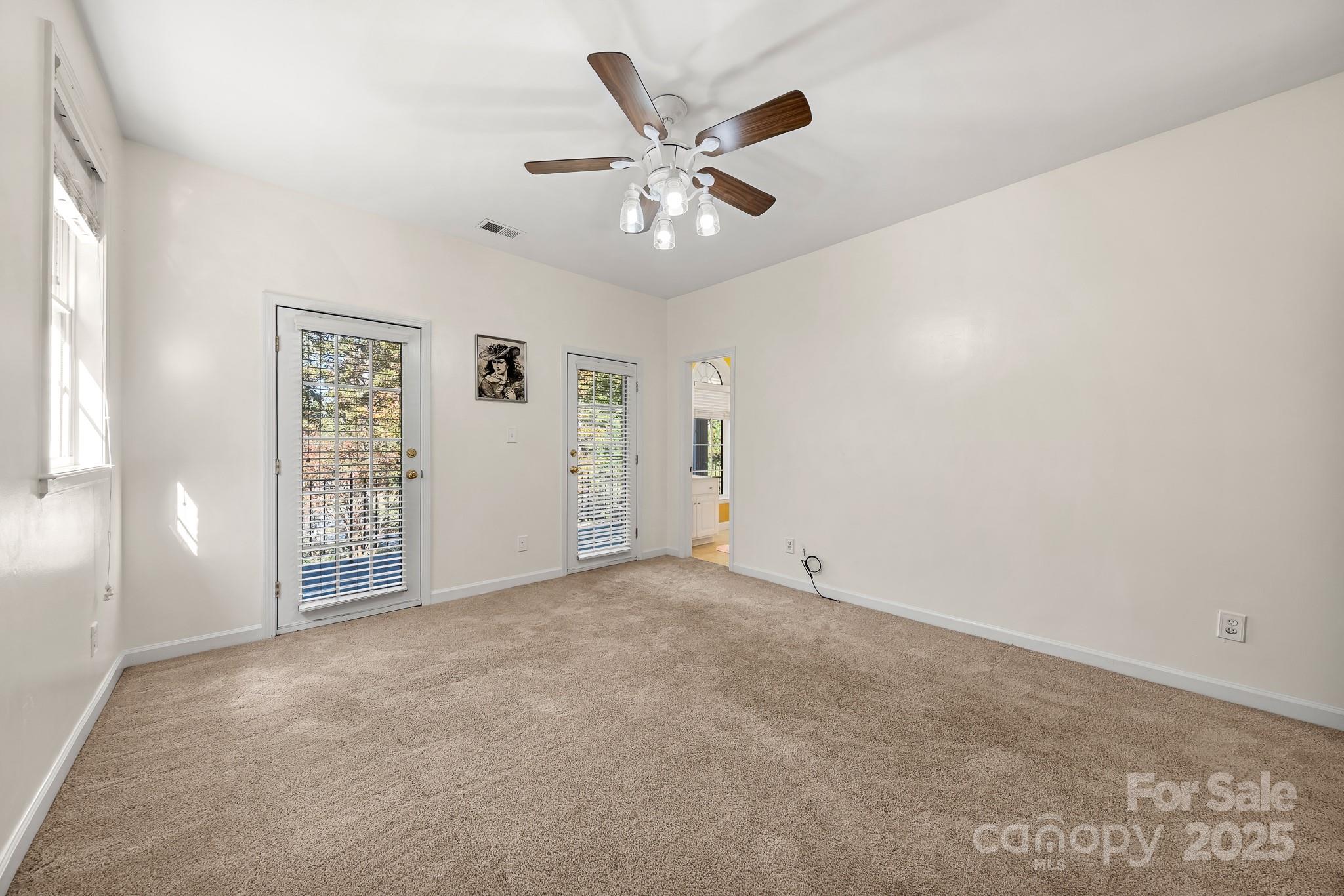 1713 Oak Park Court Iron Station, NC 28080 - Photo 36 of 39 a view of an empty room with a ceiling fan