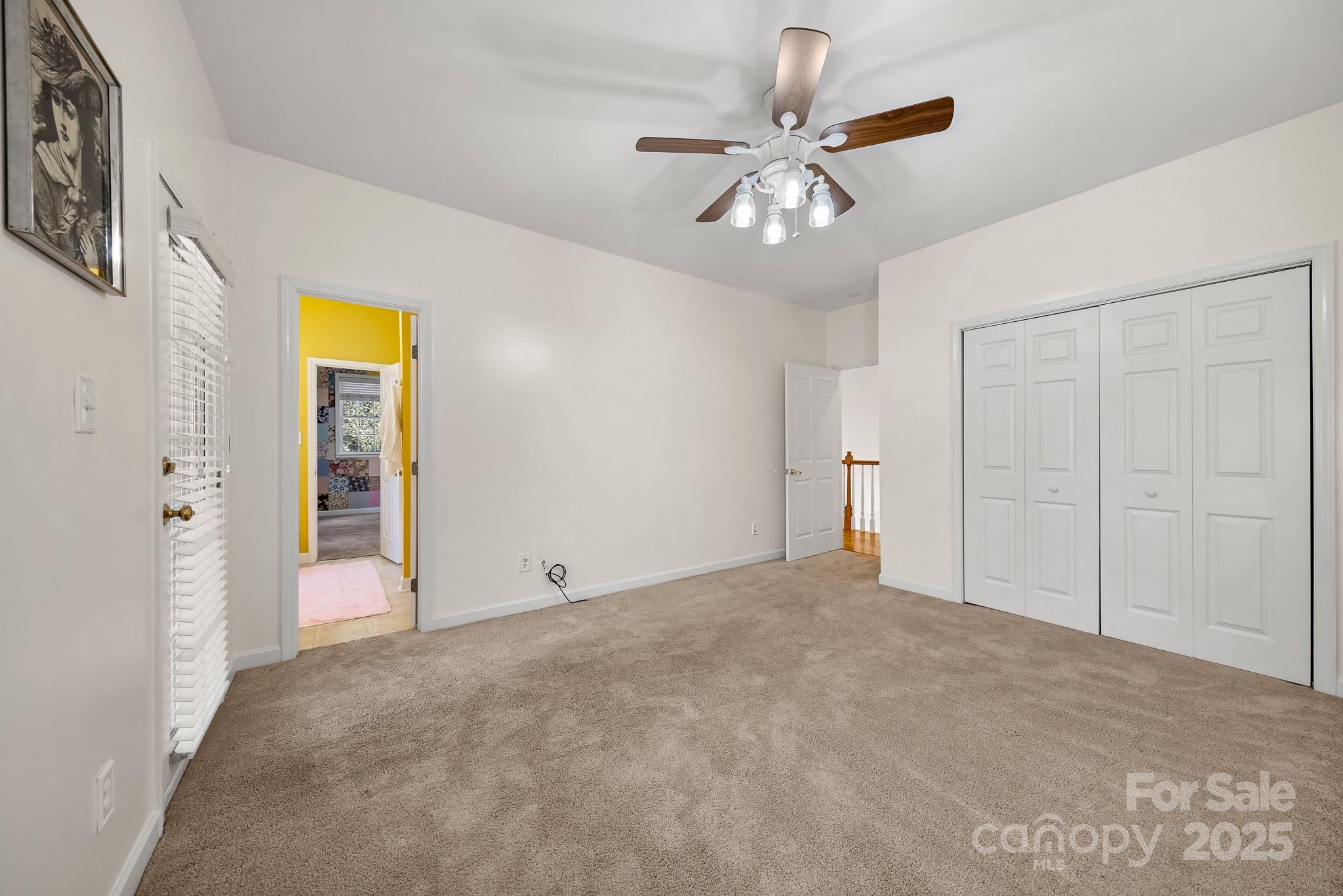 1713 Oak Park Court Iron Station, NC 28080 - Photo 37 of 39 a view of an empty room with a chandelier fan