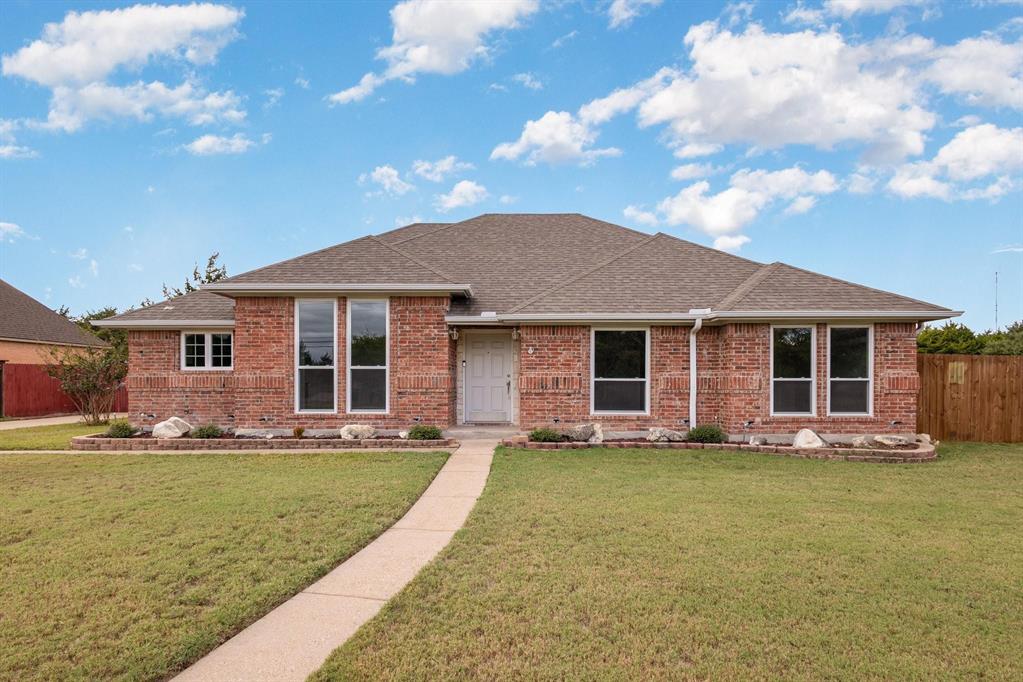 3961 Joe Wilson Road Midlothian, TX 76065 - Photo 1 of 27 a front view of a house with a garden and yard