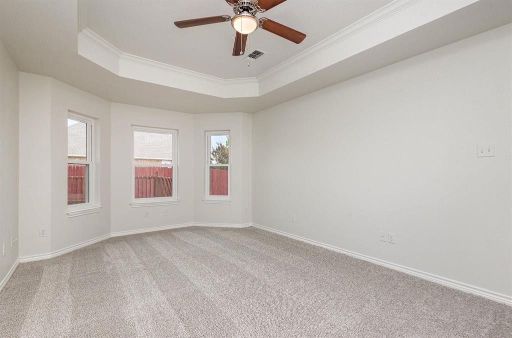 3961 Joe Wilson Road Midlothian, TX 76065 - Photo 15 of 27 an empty room with windows and fan