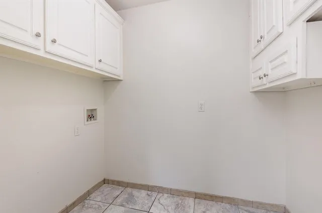 a view of small space with cabinets