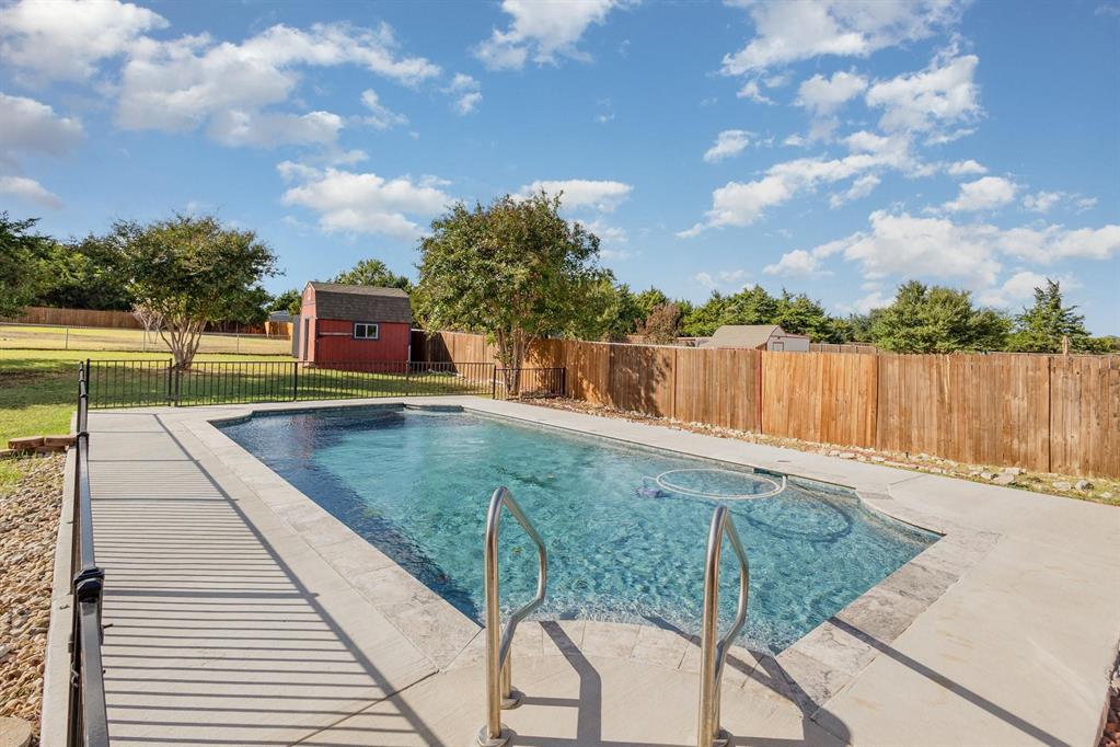 3961 Joe Wilson Road Midlothian, TX 76065 - Photo 24 of 27 a view of a swimming pool with a lounge chairs
