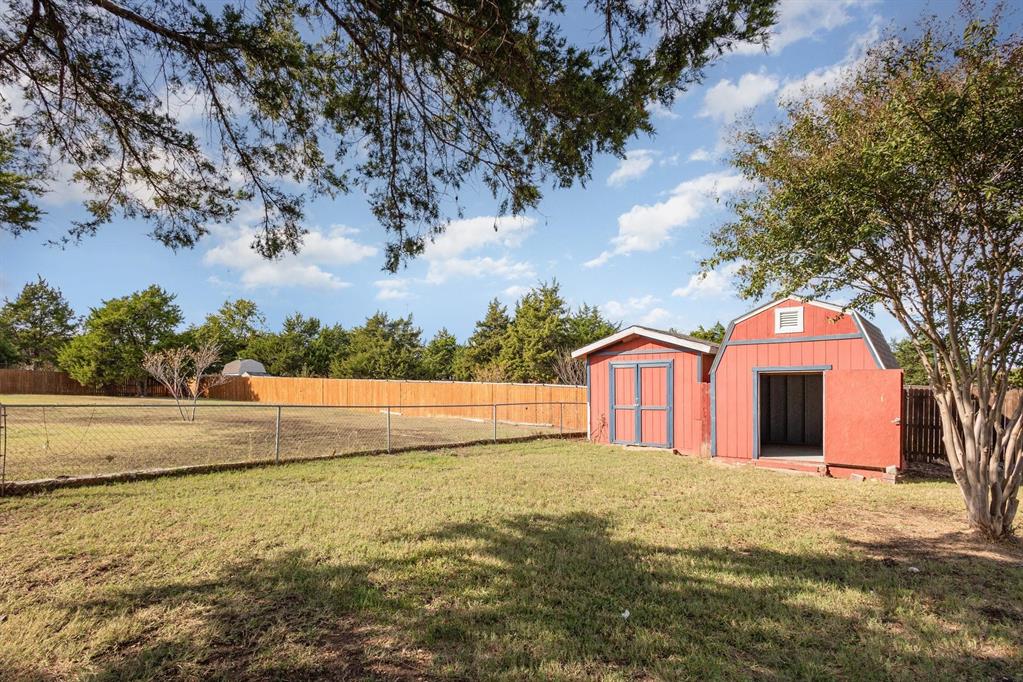 3961 Joe Wilson Road Midlothian, TX 76065 - Photo 27 of 27 a view of a house with a yard