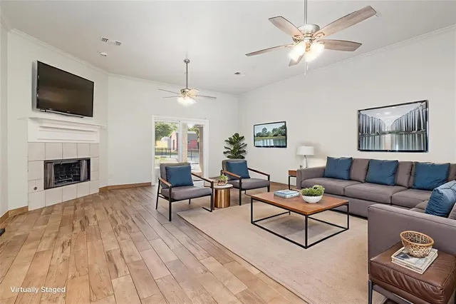 a living room with furniture fireplace and flat screen tv