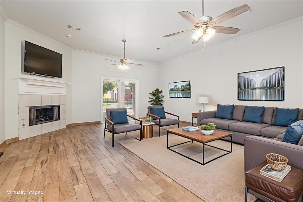 3961 Joe Wilson Road Midlothian, TX 76065 - Photo 7 of 27 a living room with furniture fireplace and flat screen tv
