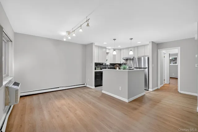 a view of kitchen with wooden floor
