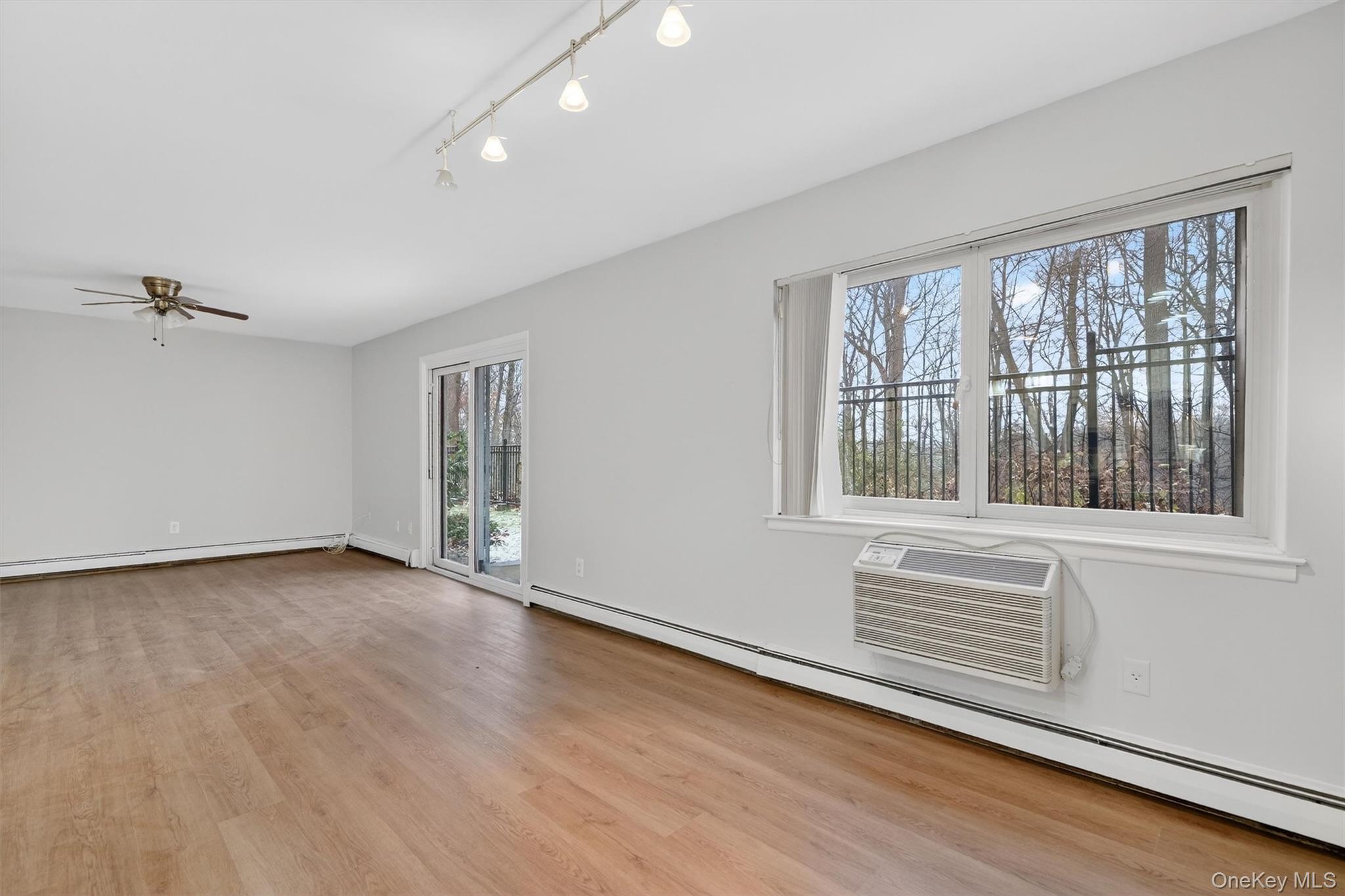 14 Scenic Drive, Unit 14T Croton-on-Hudson, NY 10520 - Photo 13 of 29 a view of an empty room with a window and wooden floor
