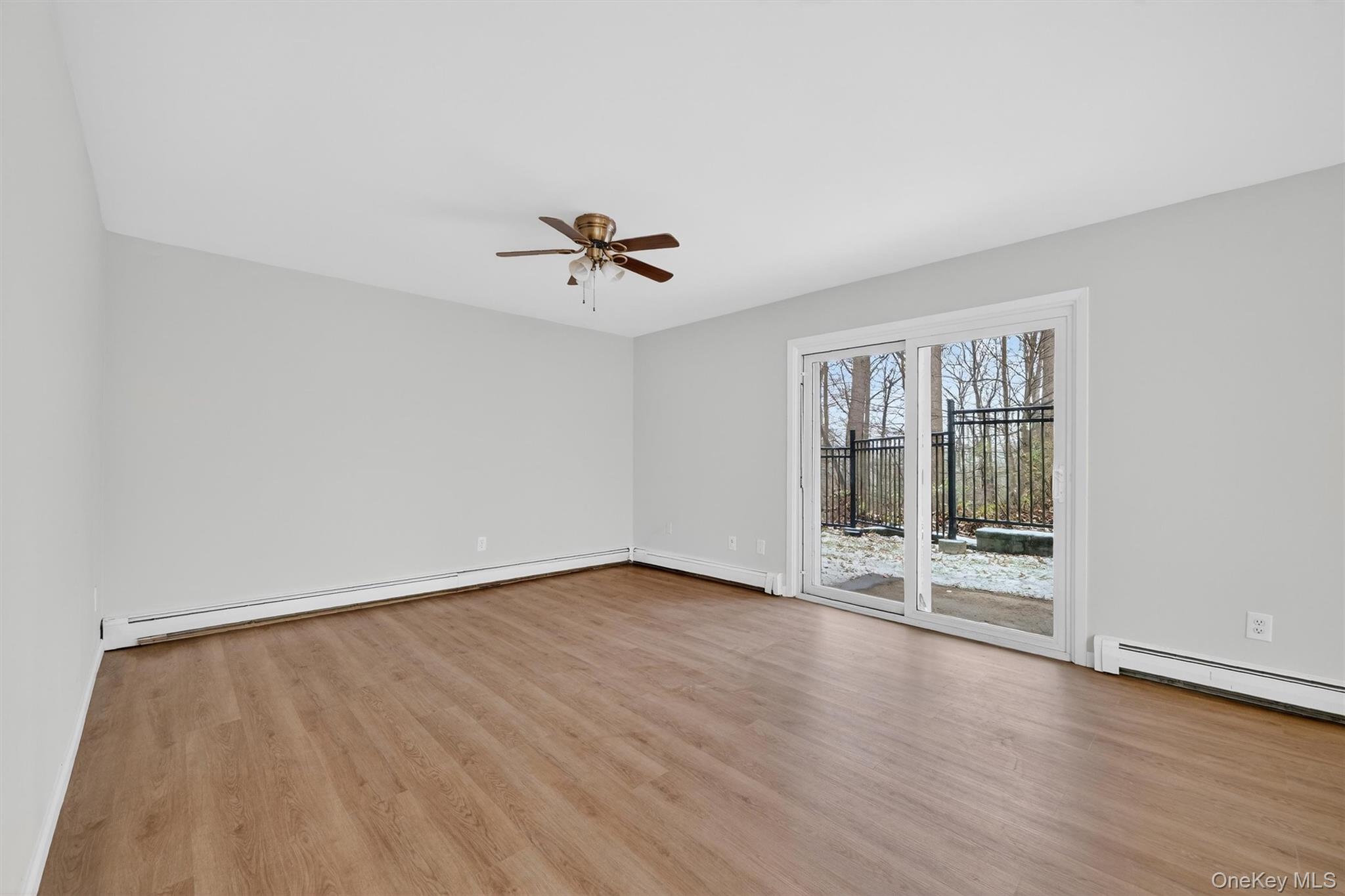 14 Scenic Drive, Unit 14T Croton-on-Hudson, NY 10520 - Photo 18 of 29 a view of an empty room with a window and wooden floor